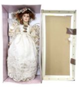 A boxed Limited Edition Kensington Collection porcelain doll formed as a lady in cream dress with