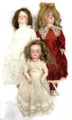 A mixed lot of medium-sized Simon & Halbig bisque head dolls to include: - Marked 1909 to nape -