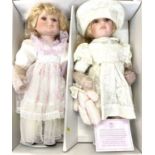 A boxed pair of Limited Edition Leonardo Collection handcrafted porcelain dolls, with certificate