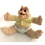 A 1990s pull-action talking Baby Sinclair from Disney/Jim Henson's Dinosaurs