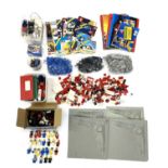 A quantity of 1960s - 1980s Lego pieces and a quantity of original paper manuals.Sets unchecked