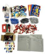 A quantity of 1960s - 1980s Lego pieces and a quantity of original paper manuals.Sets unchecked
