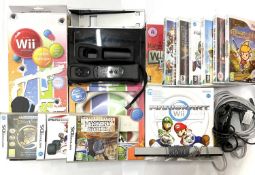 A Nintendo Wii Console in black and a quantity of accessories and games, to include: - Boxed Exspect