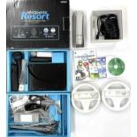 A boxed Nintendo Wii Sports Resort Pak, with console, sensor, power pack, 2 steering wheels, 2