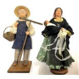 A Syndicat des Santonniers porcelain painted figurine/doll of a farmer with rake and vegetable