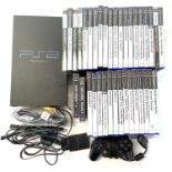 A 2000 Playstation 2 console in black, power lead and game pad (please note: in a Playstation 3