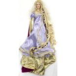 A Franklin Heirloom porcelain doll on stand, modelled as a regal Medieval lady in lilac gown with