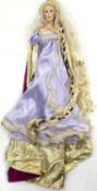 A Franklin Heirloom porcelain doll on stand, modelled as a regal Medieval lady in lilac gown with