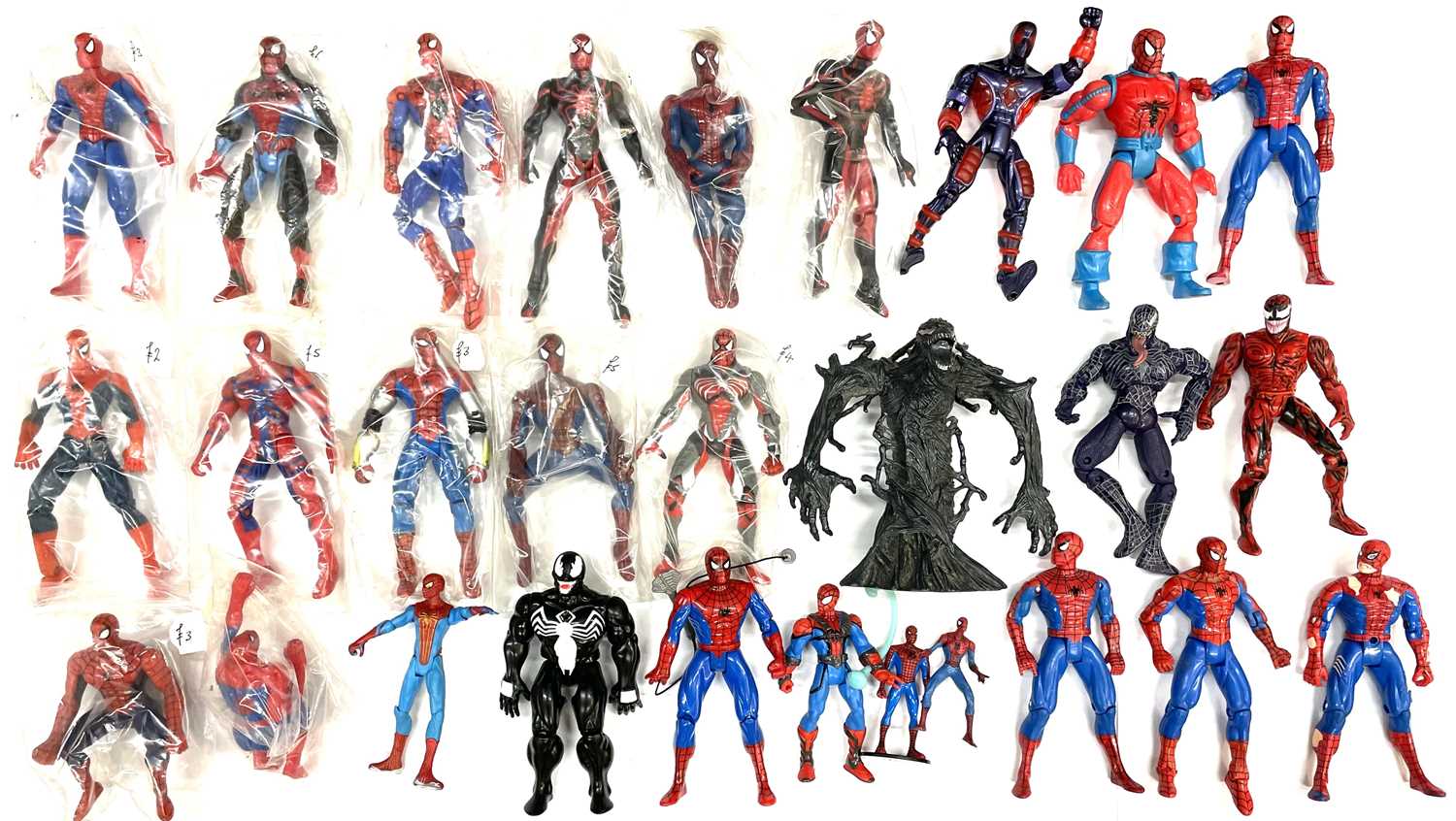 A large quantity of vintage collectible unboxed collectible Spider-Man plastic figurines, in various