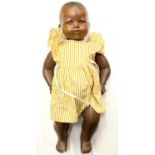 An Armand Marseille bisque head doll in yellow dress, marked 351./31/2.K to nape a/f