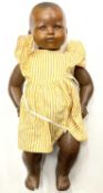 An Armand Marseille bisque head doll in yellow dress, marked 351./31/2.K to nape a/f