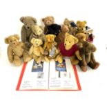 A quantity of various older and modern teddy bears of various sizes, together with a folder