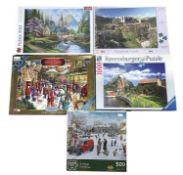 A selection of jigsaw puzzles, most still wrapped, 500-1000 pieces.