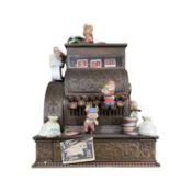 A boxed Enesco 'We're in the Money' deluxe multi-action musical box