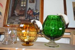 Two oversized brandy glasses with ceramic cat and mouse ornaments plus other glass wares