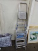 Two folding step ladders