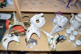 Various assorted modern masks and handcuffs