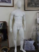 Male mannequin and four further head mannequins