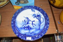 Doulton Burslem blue and white charger decorated with a figure on horseback