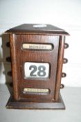 Small oak perpetual calendar, 18cm high