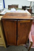 Early 20th Century two door cupboard on short cabriole legs