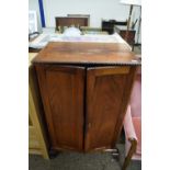 Early 20th Century two door cupboard on short cabriole legs