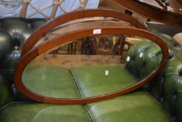 Two oval wall mirrors