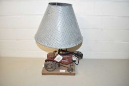 Modern table lamp, the base formed as a tractor