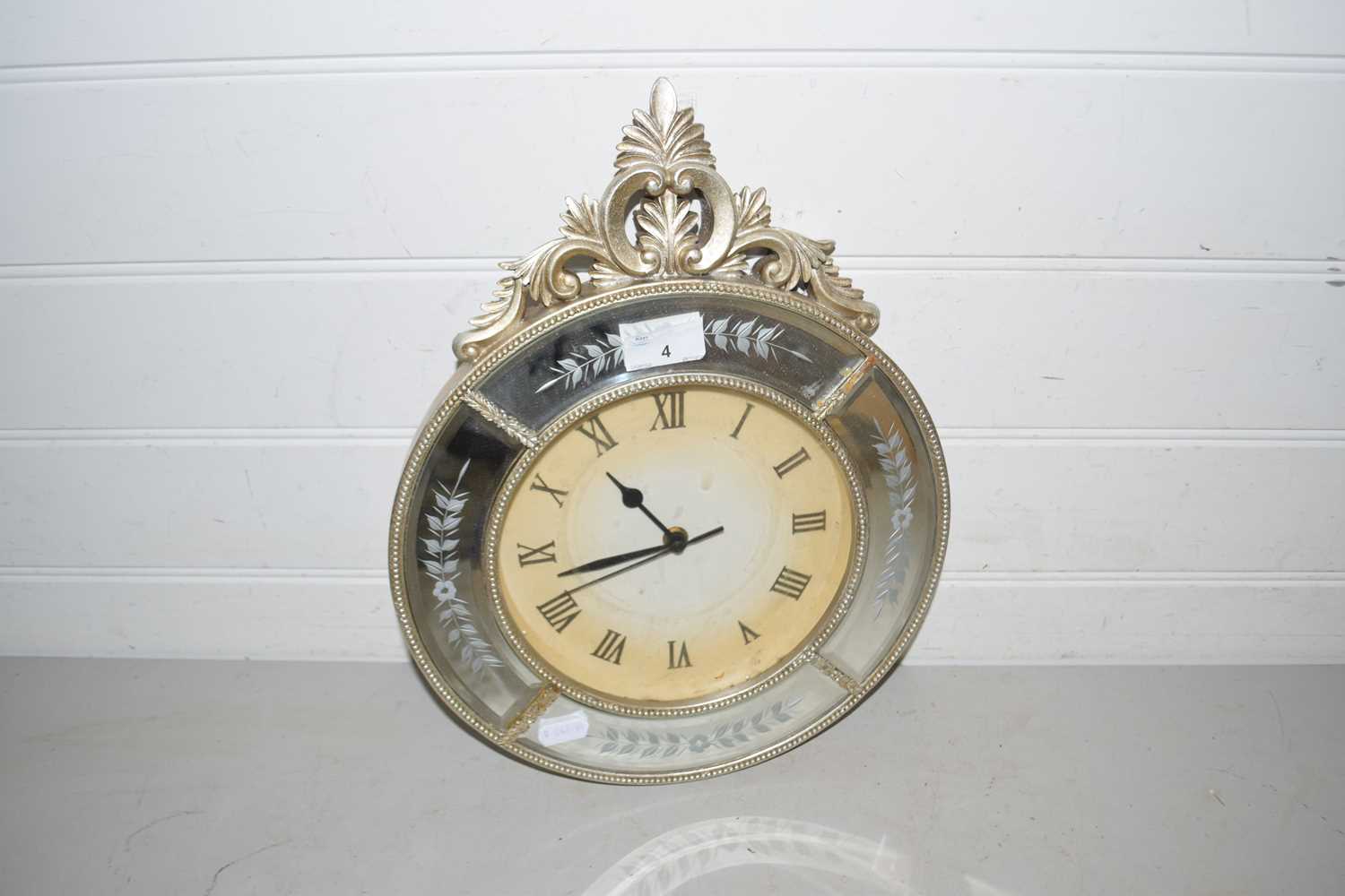 Modern wall clock in mirrored frame