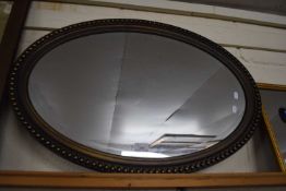 Oval bevelled wall mirror