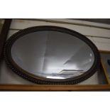 Oval bevelled wall mirror