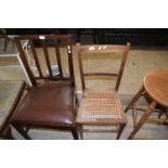 Cane seated business chair and a mahogany dining chair