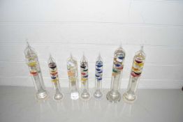 Collection of seven glass Galileo type thermometers