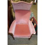 Pink upholstered armchair