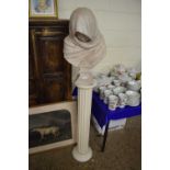Modern ceramic bust of a figure in shawl together with accompanying stand (2)
