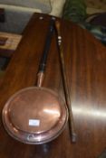 Copper bed warming pan and a walking stick
