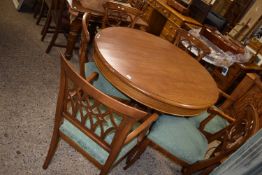 Circular pedestal dining table together with six accompanying dining chairs