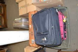 Five various assorted suitcases