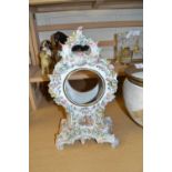 Porcelain clock case with floral decoration, no movement