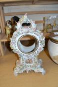 Porcelain clock case with floral decoration, no movement