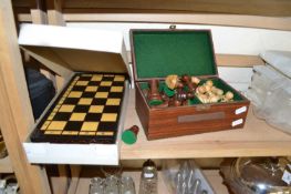 Modern turned wooden chess set and accompanying folding board