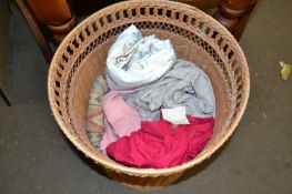 Wicker laundry basket and various contents