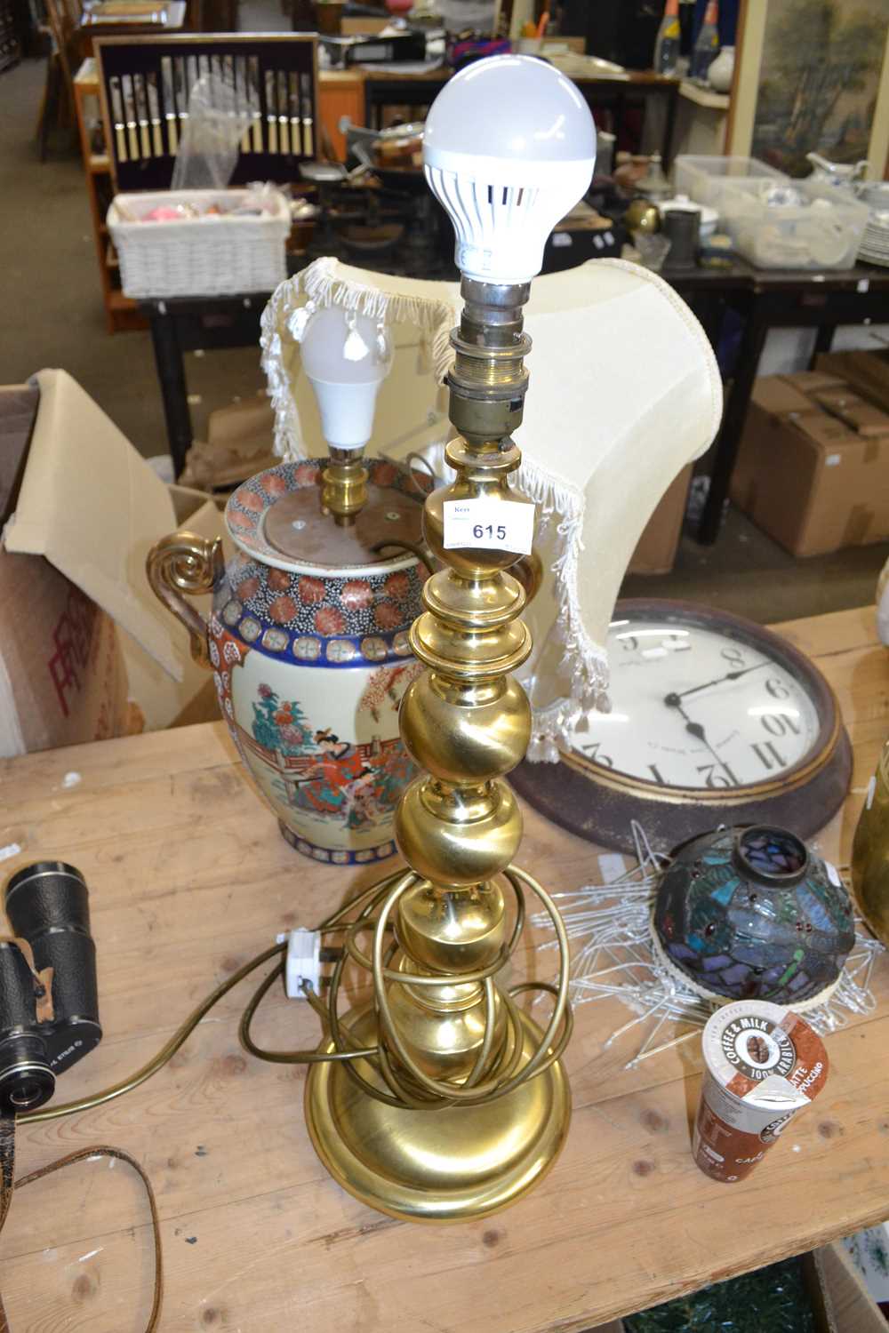 Modern Oriental table lamp together with a brass table lamp
