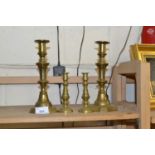 Two pairs of brass candlesticks