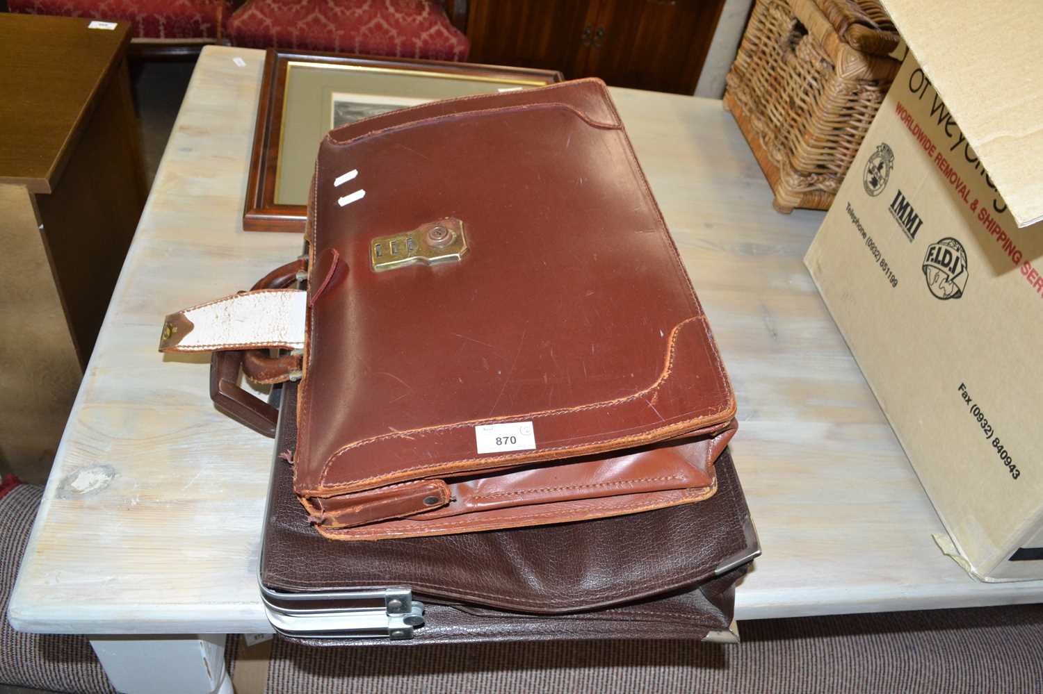 Brown leather case and one other (2)