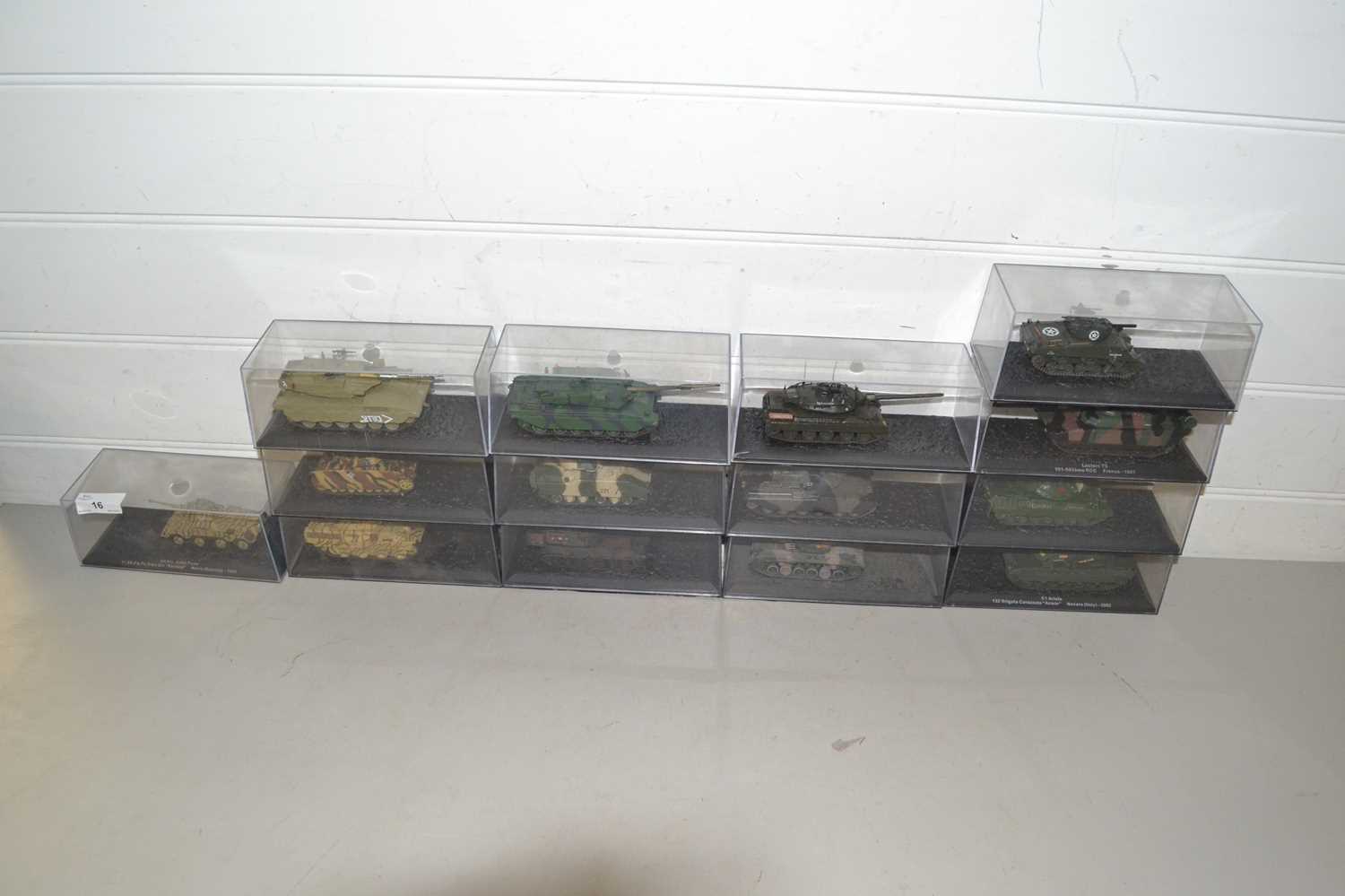 Collection of boxed modern military vehicles, mainly tanks