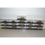 Collection of boxed model military vehicles