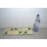 Three late Victorian floral decorated tiles and a blue and white figure (a/f)