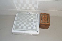 Modern glass chess set together with a case of playing cards