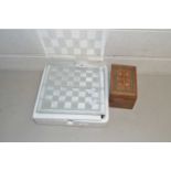 Modern glass chess set together with a case of playing cards